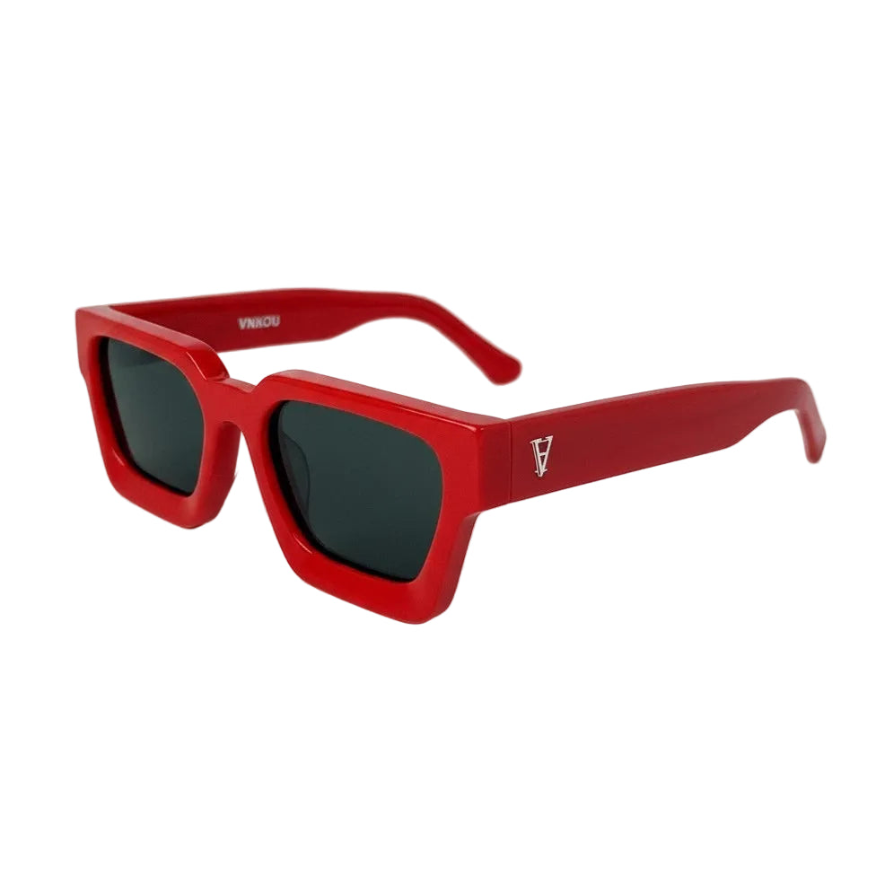 Red sunglasses with a brand logo on a white background