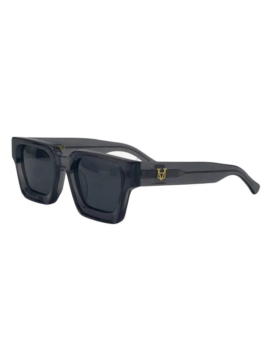 Sunglasses with tortoiseshell frame and dark lenses on a white background